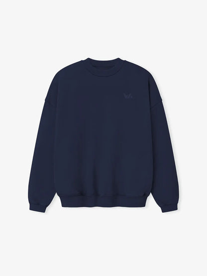 Crewneck oversized WE ARE color azul marino, vista frontal con cuello redondo, silueta estructurada y logo discreto en el pecho.