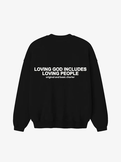 Crewneck oversized WE ARE color negro, vista posterior con estampado “Loving God Includes Loving People” en la espalda.