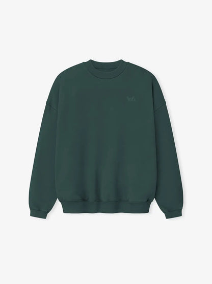 Crewneck oversized WE ARE color verde, vista frontal con cuello redondo, silueta estructurada y logo discreto en el pecho.