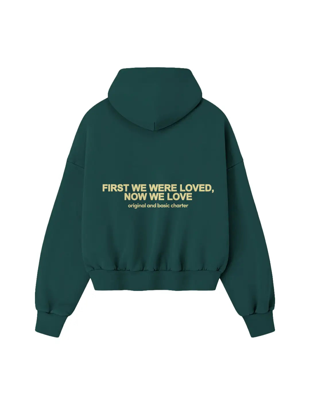 Hoodie oversized WE ARE verde, vista posterior con estampado “First We Were Loved, Now We Love”.